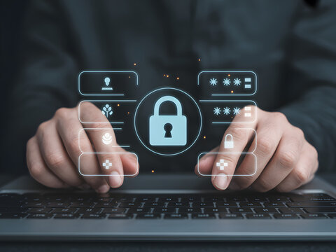 A person using a laptop with holographic security icons and a padlock symbolizing cybersecurity and data protection.