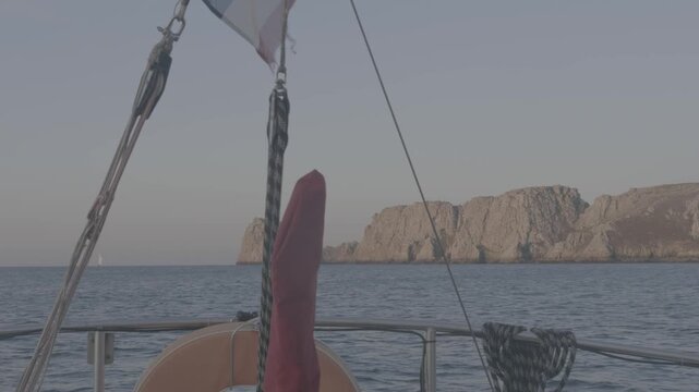 View of Les Tas de Pois cliffs from a sailboat at anchor, Camaret, Brittany