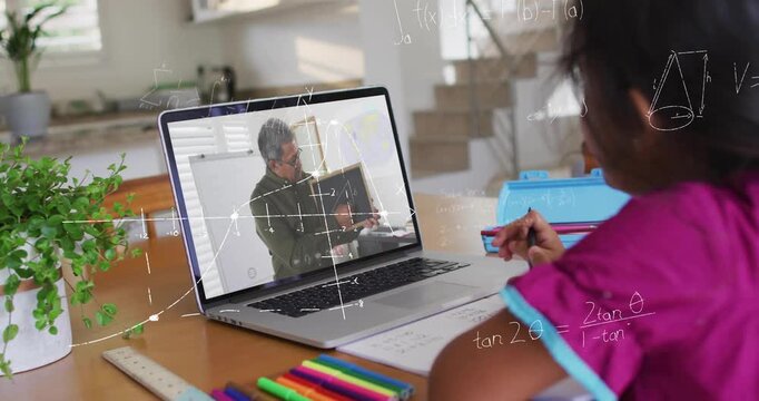 Child writing at desk on laptop, tutor turning board and adding math overlays guiding study