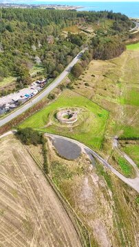 Aerial View of Carn Liath Broch, a Prehistoric Iron Age Stone Fortress in the Scottish Highlands, Ancient Archaeological Heritage Site in Sutherland, Scotland