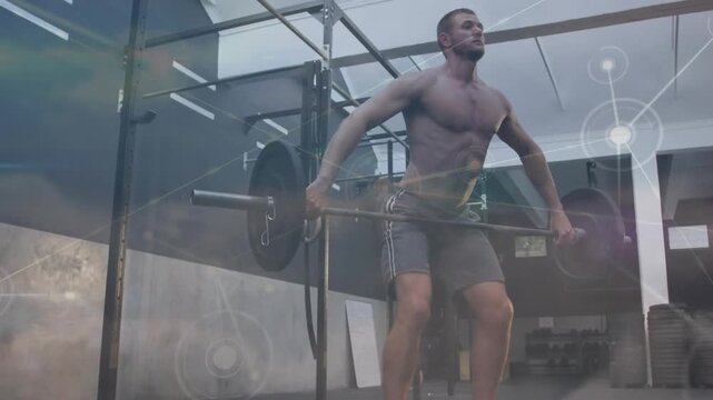 Vertical video: Man initiating pull, snatching barbell overhead for fitness, overlays tracing path