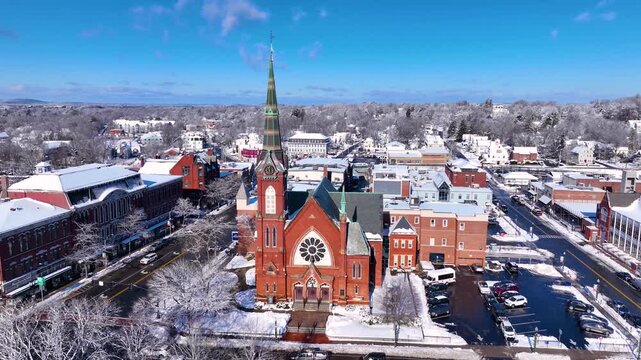 First Congregational Church aerial view in winter with snow at 2 E Central Street in historic town center of Natick, Massachusetts, USA.