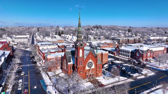 First Congregational Church aerial view in winter with snow at 2 E Central Street in historic town center of Natick, Massachusetts, USA.