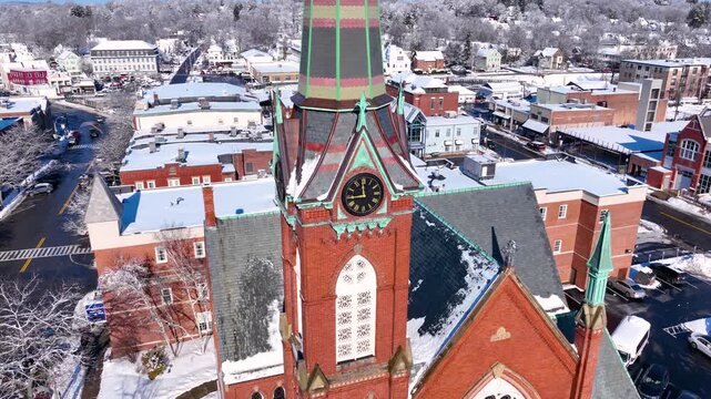 First Congregational Church aerial view in winter with snow at 2 E Central Street in historic town center of Natick, Massachusetts, USA.