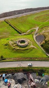 High-Angle Aerial Perspective of Carn Liath Broch Near the Sutherland Coastline, Historic Stone Tower Overlooking the North Sea, Scottish Highlands Wilderness