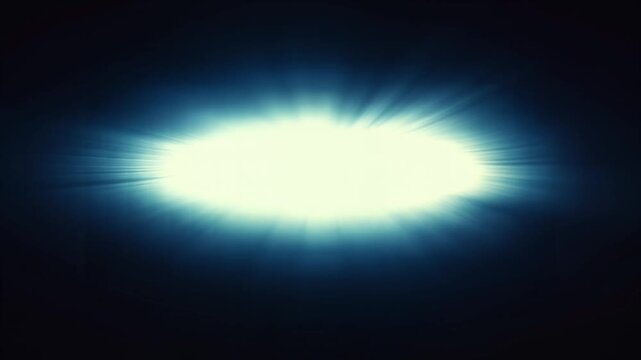 A bright light shines in the darkness of space with rays emanating outward.