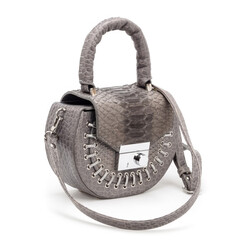 High-quality studio shot of a stylish female bag with a python effect. Perfect for e-commerce, fashion blogs, and advertising campaigns focusing on modern animal print accessories. © Jan
