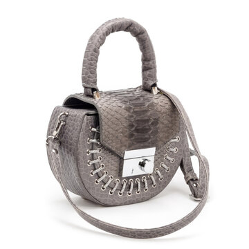 High-quality studio shot of a stylish female bag with a python effect. Perfect for e-commerce, fashion blogs, and advertising campaigns focusing on modern animal print accessories.