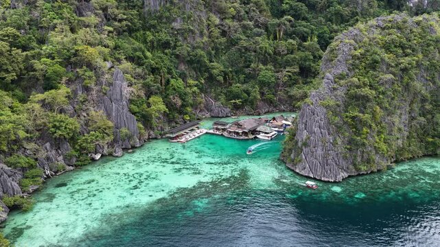 Cinematic drone video of tropical islands of Coron in the Philippines,  with azure blue water and lime stone rock formations