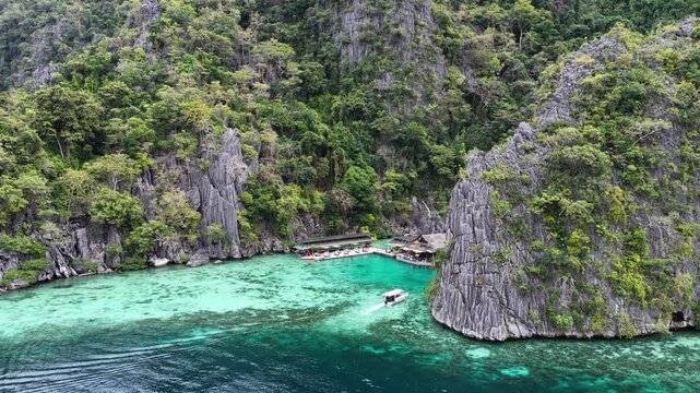 Cinematic drone video of tropical islands of Coron in the Philippines,  with azure blue water and lime stone rock formations