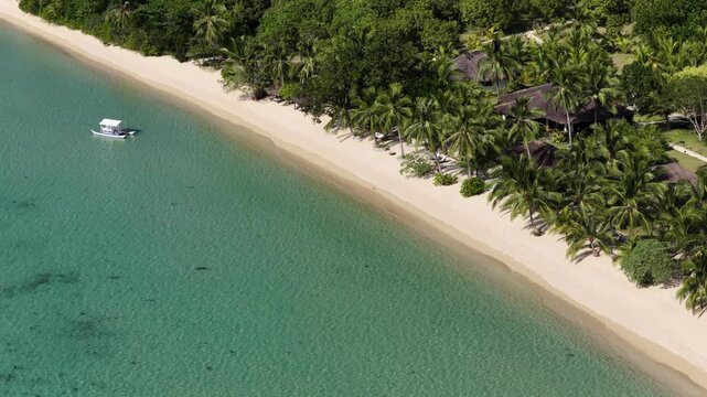 Cinematic drone video of tropical island with perfect sand beach in the Philippines  with azure blue water and beach
