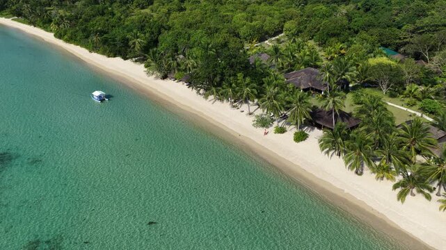 Cinematic drone video of tropical island with perfect sand beach in the Philippines  with azure blue water and beach