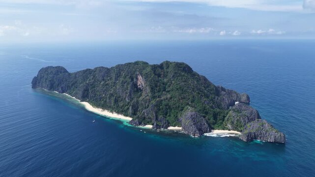 Cinematic drone video of tropical island in the Philippines  with azure blue water and beach