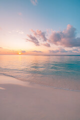 Breathtaking tropical beach at sunset with radiant golden sky, tranquil ocean waves and pristine island shore, dreamy summer vacation travel background