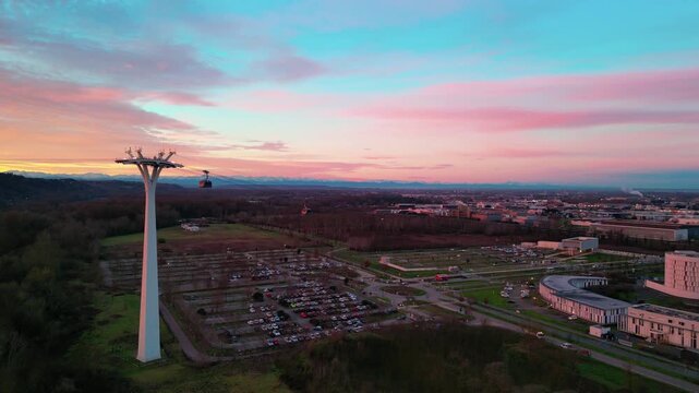 Cable car at sunrise in France, with a view of the Pyrenees in the background