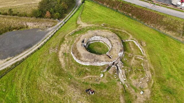 High-Angle Aerial Perspective of Carn Liath Broch Near the Sutherland Coastline, Historic Stone Tower Overlooking the North Sea, Scottish Highlands Wilderness