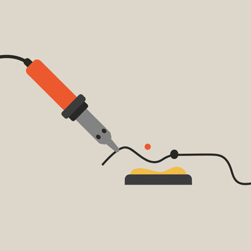 A soldering iron with a hot tip is shown melting solder onto a wire, with a small blob of molten metal visible.