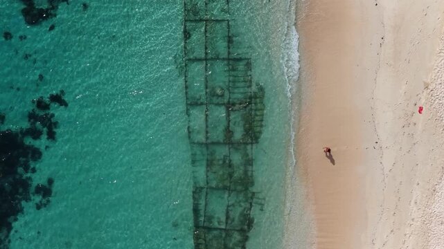 Cinematic drone video of tropical island in the Philippines  with azure blue water and beach