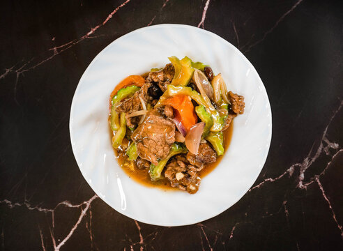 Stir fried beef with bitter melon and vegetables in savory sauce Filipino Beef Ampalaya