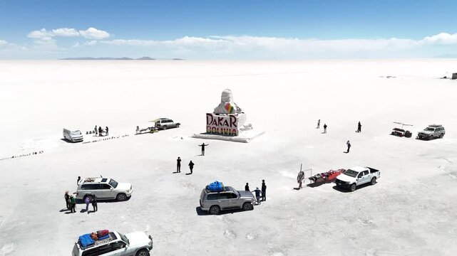 Salar de Uyuni. Endless white landscape and rider on the vast Bolivian salt flats.