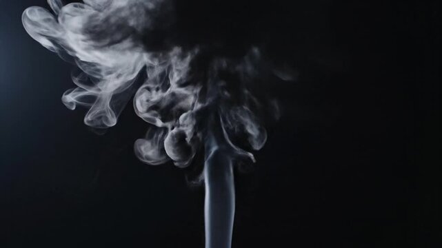 Smoke rising in the darkness.