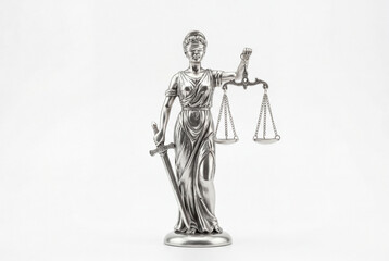 Silver metallic lady justice statue holding scales and sword