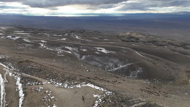 Panoramic view of Route 40 (Ruta 40) from Mirador Julio Heredia El Monito. Winding highway in the vast Santa Cruz steppe.
