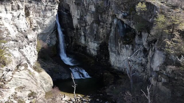 Chorrillo del Salto waterfall in El Chalten, Patagonia. Beautiful cascade surrounded by native forest and rocky cliffs.