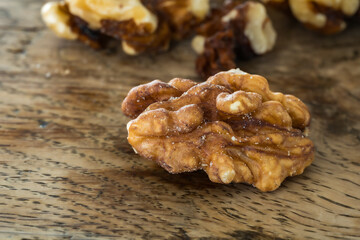 Obraz premium rganic Roasted Walnuts on Rustic Wooden Background