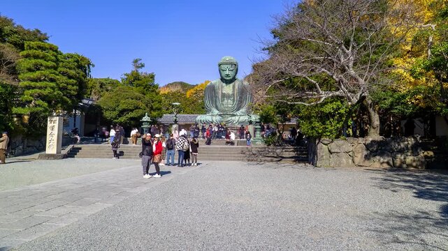 KAMAKURA, JAPAN. DEC 2025. HYPERLAPSE. Panoramic view of the Giant Buddha bronze statue at Kōtoku-in Temple in Kamakura Prefecture, Japan. This statue is an attraction that draws thousands of tourists