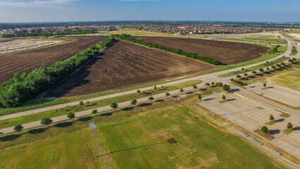 Naklejka premium Aerial Drone photo of McKinney Soccer Complex at Craig Ranch at sunset
