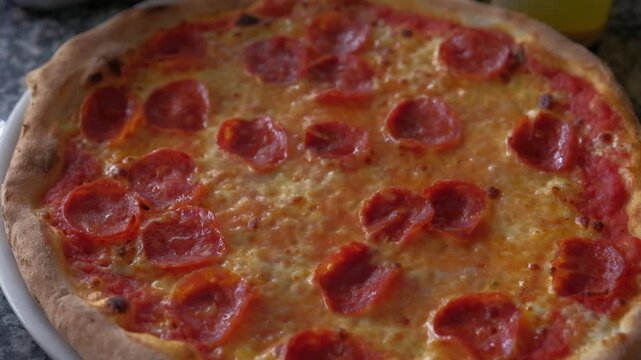 Pepperoni pizza close up spinning on table. High quality FullHD footage