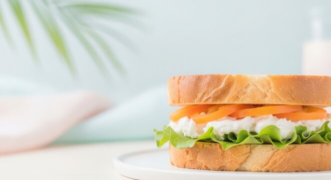 Whisked sandwich, creamy filling, fresh lettuce, orange topping on plate. Whisked sandwich includes soft bread, delicate whipped ingredients, crisp greens, representing new culinary ideas.