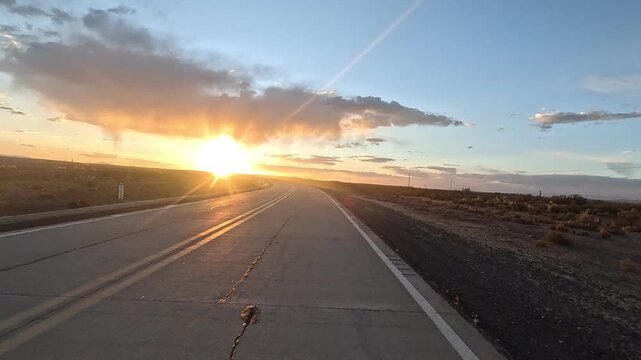 Motorcycle riding from San Pedro de Atacama to Uyuni salt flats. First-person view of high altitude desert road and Altiplano landscape.