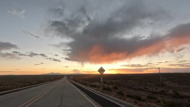 Motorcycle riding from San Pedro de Atacama to Uyuni salt flats. First-person view of high altitude desert road and Altiplano landscape.