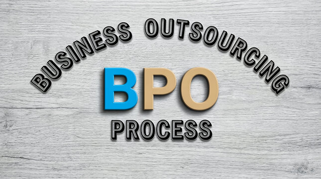 Business process outsourcing bpo text with blue and beige letters on textured concrete wall background