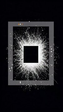 A gray square frame with a bright white light exploding from a black center on a black background with white specks