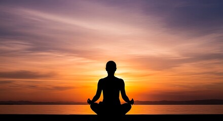 Fototapeta premium Meditating Person Sitting on Beach at Sunset