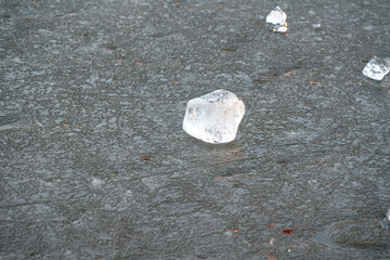 Ice Cubes on a shown clearly in the frame in an outdoor setting, with snowy surroundings, under daylight, with a natural mood, suitable for marketing, editorial, and digital storytelling.