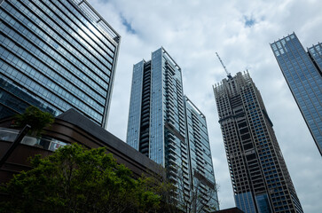 Fototapeta premium Modern skyscrapers under overcast sky