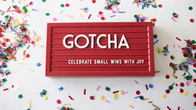 Red Letterboard With Confetti Saying Gotcha Celebrate Small Wins