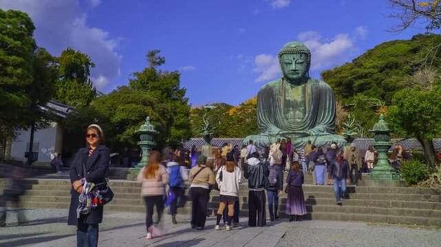 KAMAKURA, JAPAN. DEC 2025. TIMELAPSE. Panoramic view of the Giant Buddha bronze statue at Kōtoku-in Temple in Kamakura Prefecture, Japan. This statue is an attraction that draws thousands of tourists 