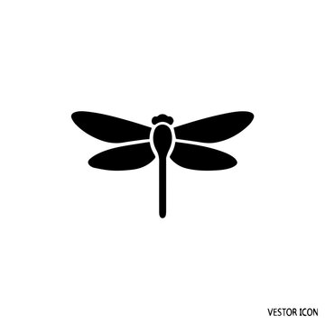 Elegant black silhouette of a dragonfly in mid-flight pose