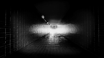Light at the end of the tunnel. Original analog black and white photo taken with a Nikon FM3A camera and Ilfort 400 HP5 film.