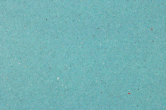 Blue recycled paper texture background with organic colorful particles