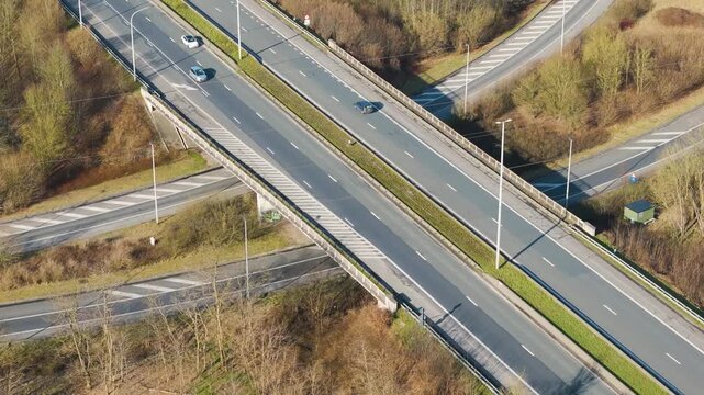 motorway overpass diverging slip roads ghent vehicles travelling through structured highway layout near close aerial drone view traffic transport infrastructure transportation 