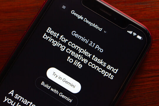 Quito, ECUADOR - Feb 23 2026 : Close-up of a smartphone displaying the Google DeepMind Gemini 3.1 Pro page on a wooden desk.