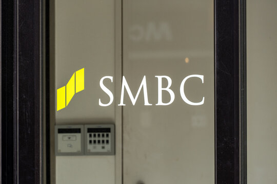 NERIMA, TOKYO, JAPAN - MARCH 11, 2026: The SMBC brand logo displayed on the glass window of a Sumitomo Mitsui Banking Corporation branch in Nerima, Tokyo.