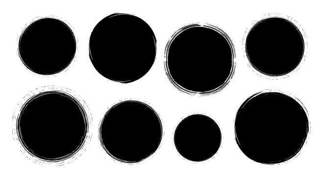 Set of eight black grunge ink circles with rough edges.