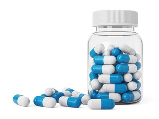 A clear plastic bottle filled with blue and white pills spilled on a white background isolated on white background